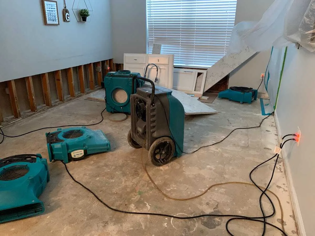 Dehumidifier in flood-cut room for Water Damage Restoration in Pelican Bay